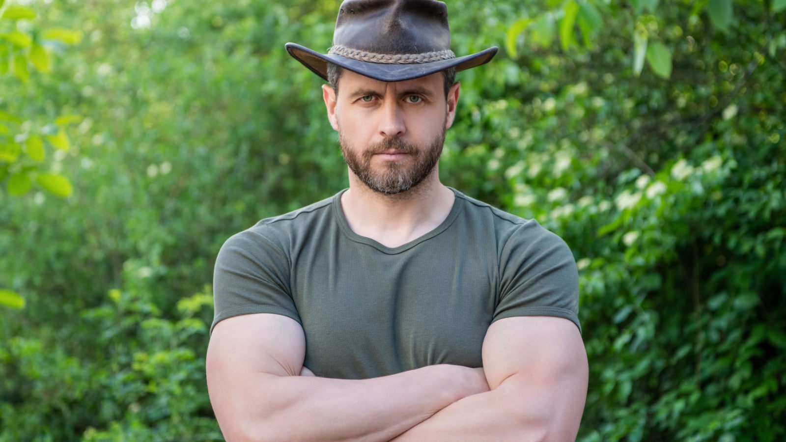 macho man muscles cowboy hat