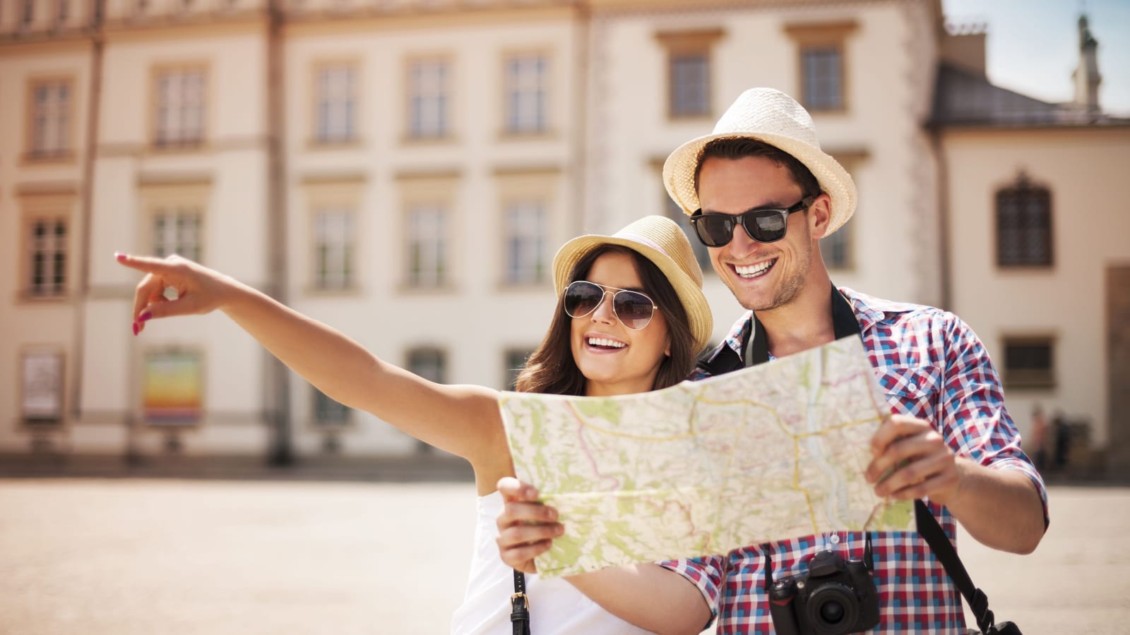 couple with map traveling