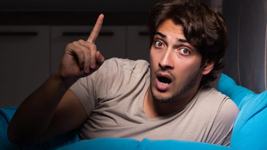 man getting idea in bed