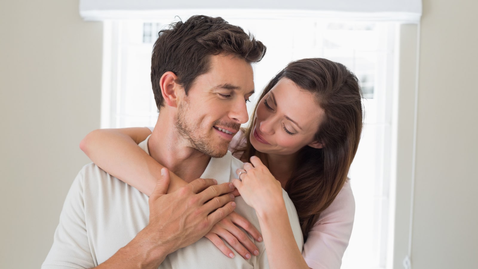 woman hugging man from behind