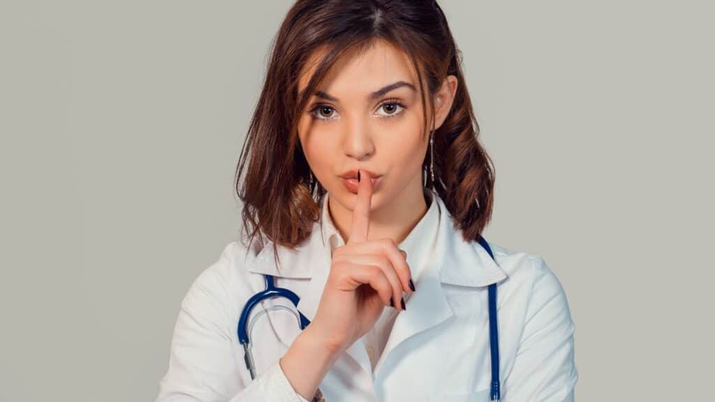 doctor shhh finger over mouth