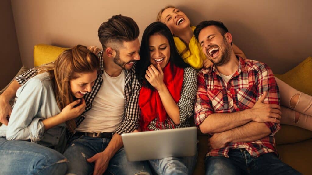belly laughing with friends couch