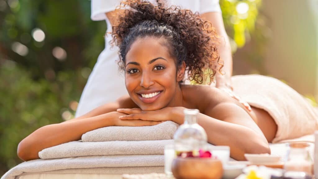 beautiful Black woman getting back massage