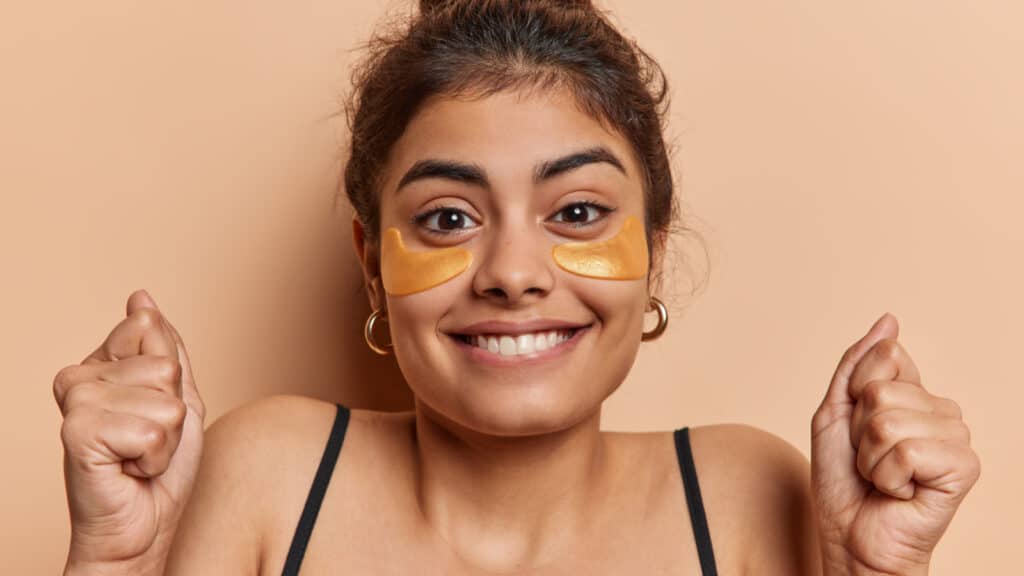 happy woman wearing eye pads