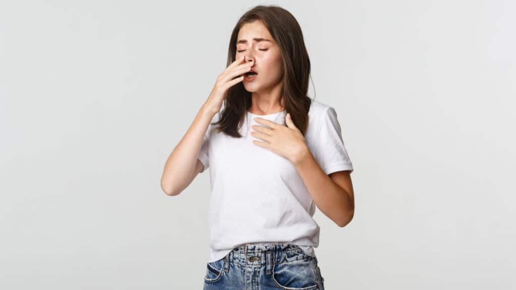 woman sneezing tingles