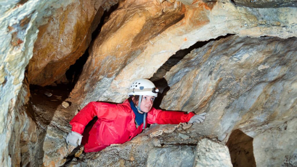 Spelunking caver caves