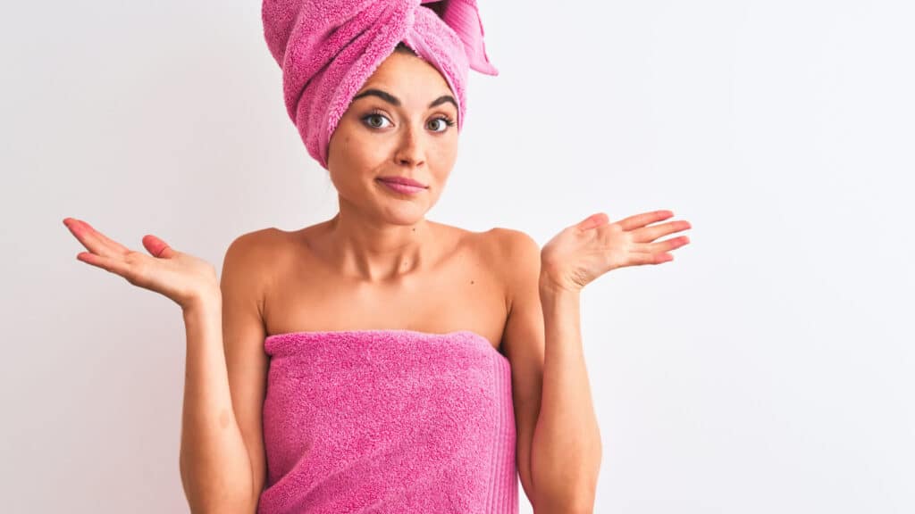 confused women in towel shower beauty