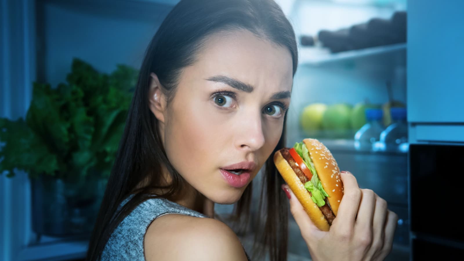 diet fail woman eating hamburger