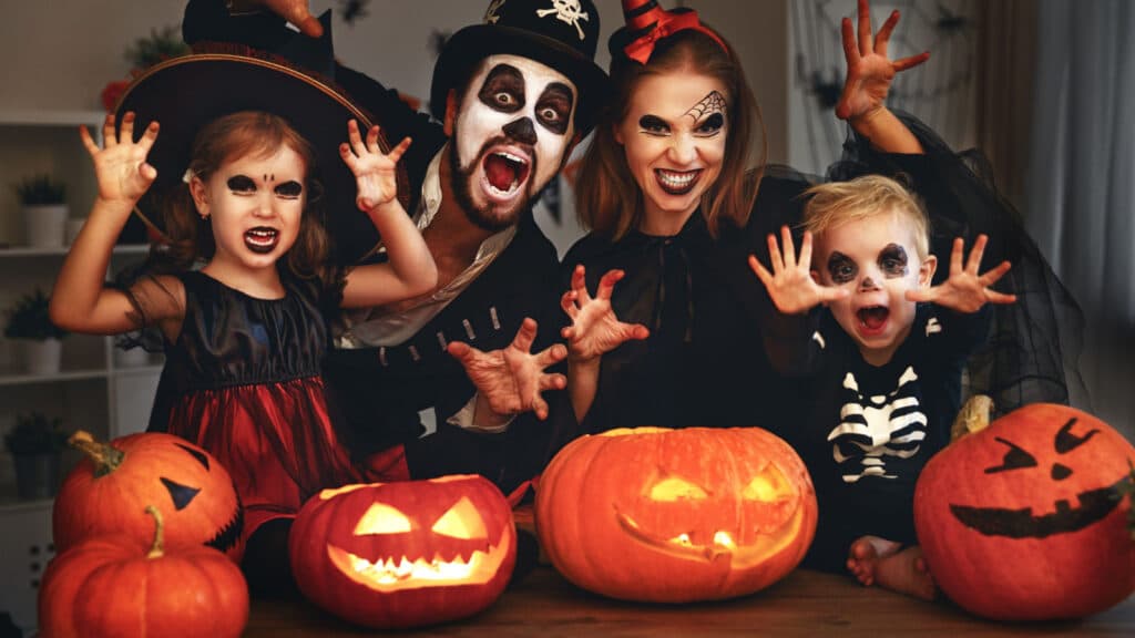 happy Halloween family with pumpkins