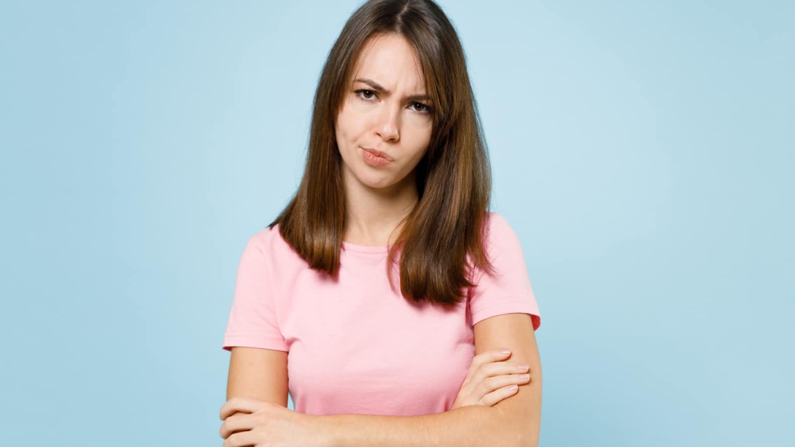judging woman smirk arms crossed