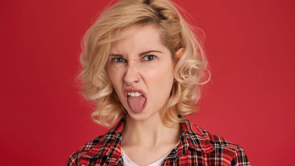 woman disgusted with tongue out yuck