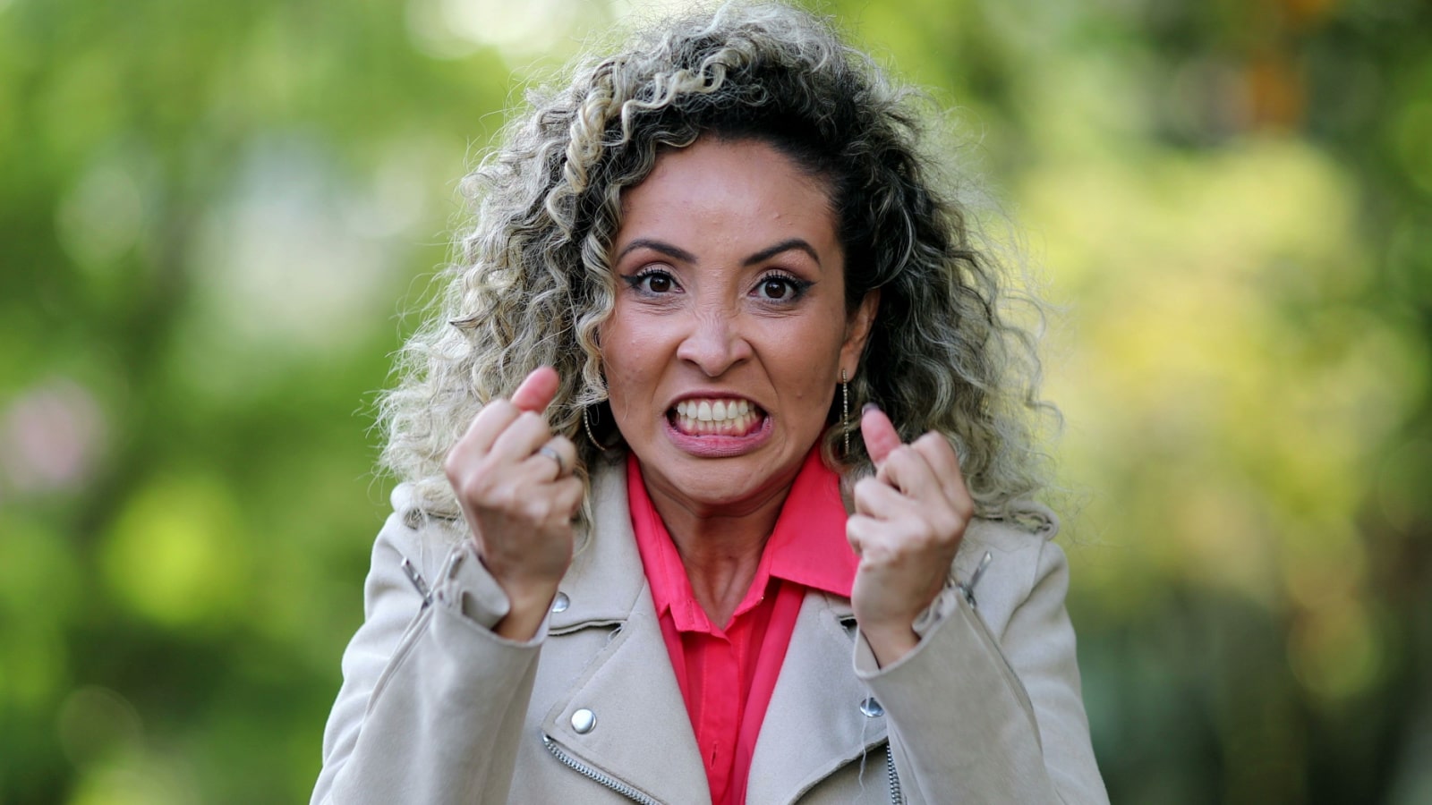 frustrated angry woman balled fists reaction