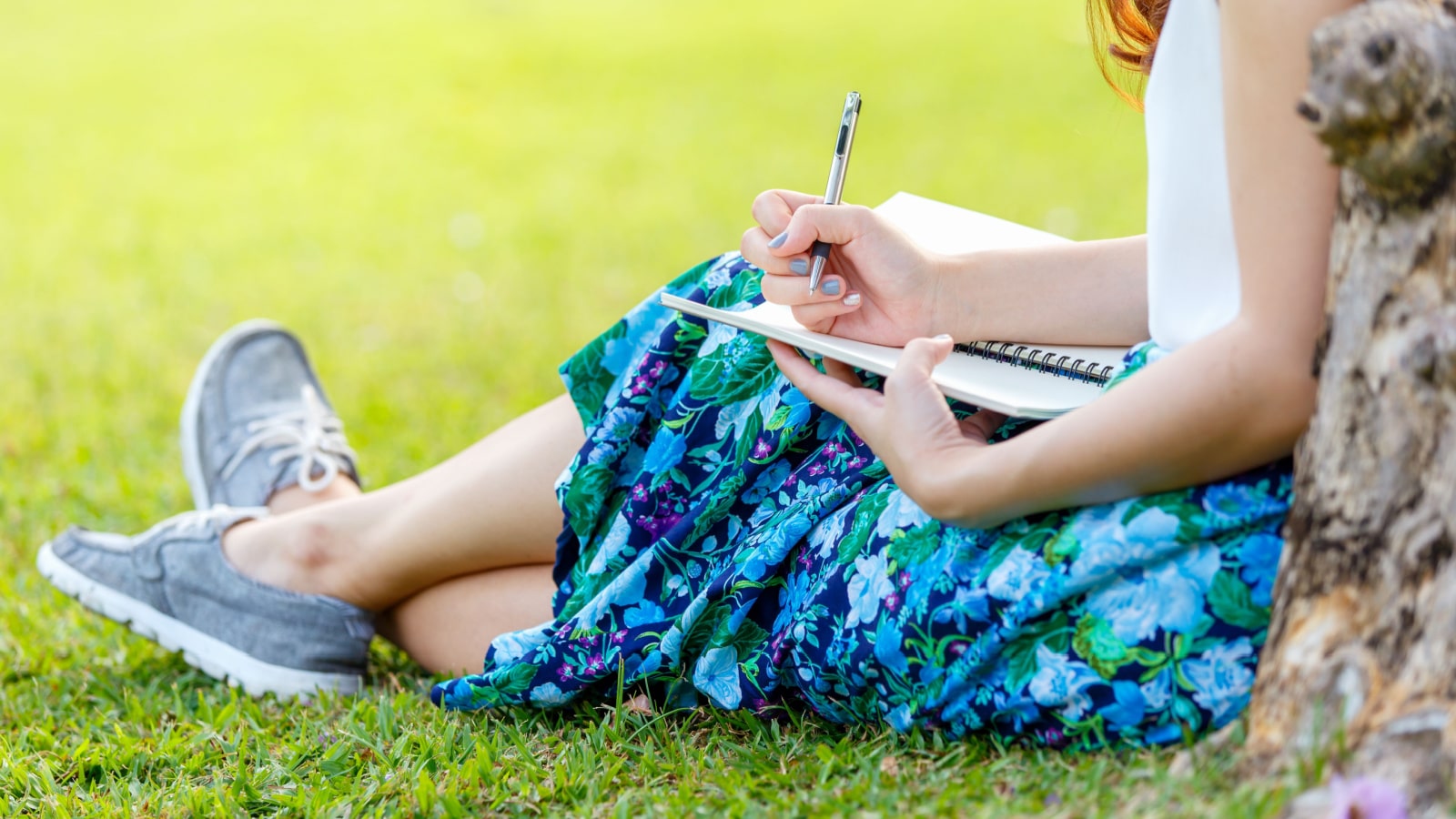 woman journaling in the park